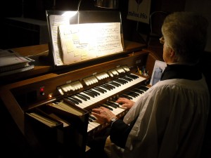 Music Director Roberta Stamper playing the organ.